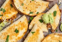 Crispy Baked Bean and Cheese Tacos with Avocado Crema