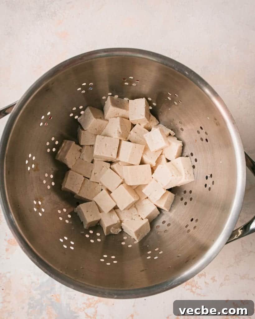 Creamy Vegan Pumpkin Curry with Crispy Tofu 11 boiled tofu draining