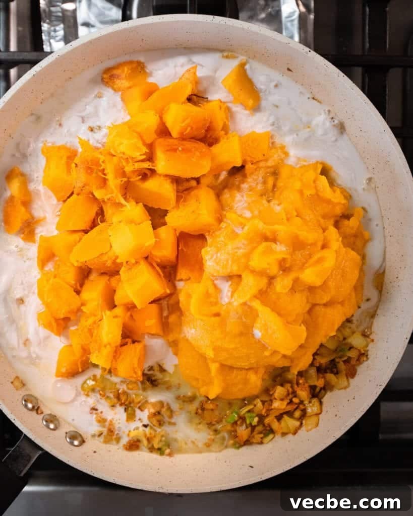 Creamy Vegan Pumpkin Curry with Crispy Tofu 18 roasted pumpkin cubes added to curry