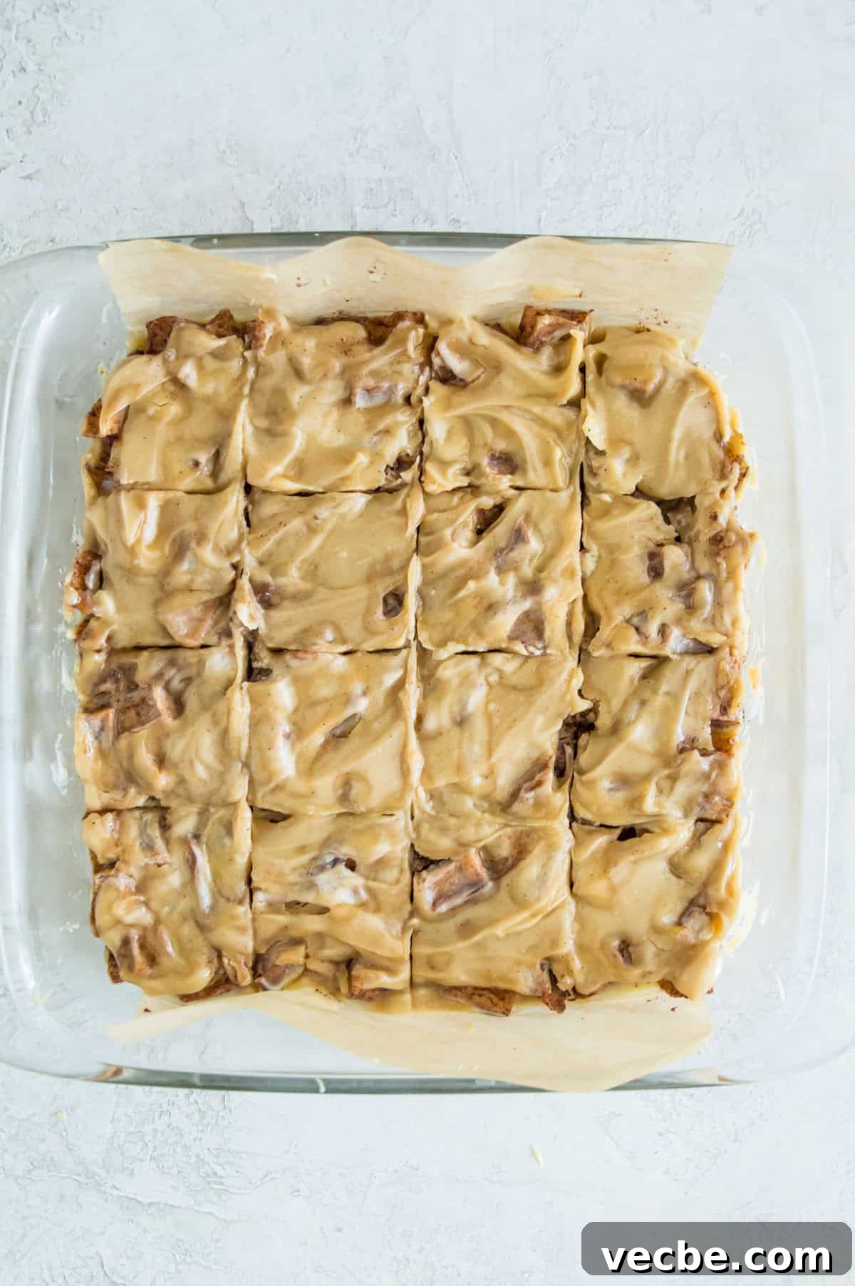Apple Pie Bars Gluten Free Vegan and Paleo 11 A square baking pan with caramel apple bars in it cut into squares.