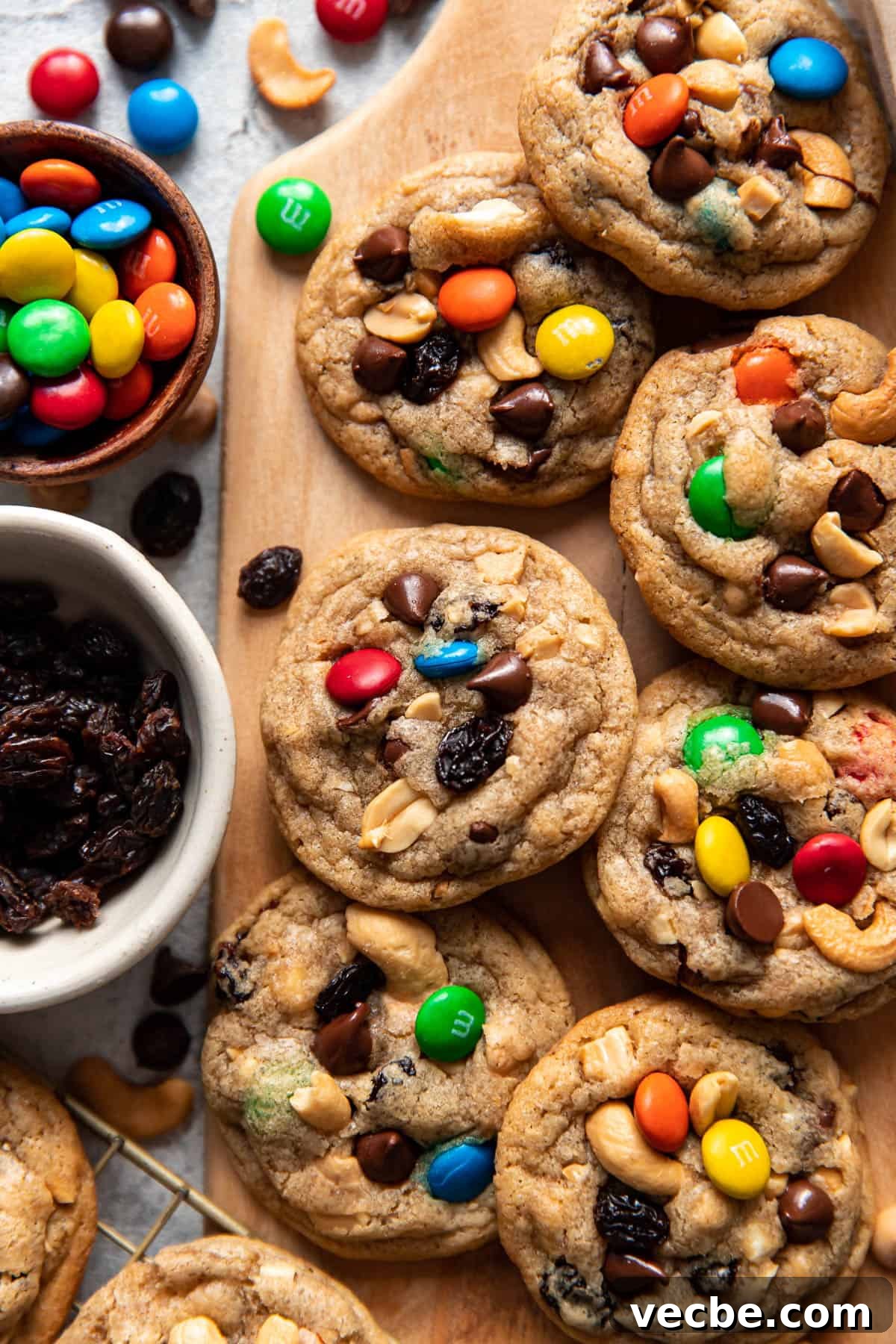 Trail Mix Cookies Recipe with Oats Nuts and Chocolate 4 trail mix cookies on a platter.