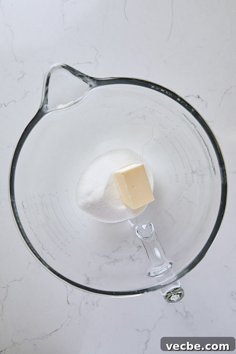 From-Scratch Peach Upside-Down Cake Recipe 6 Butter and granulated sugar in glass mixer bowl