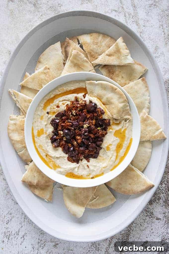 Creamy White Bean Dip Recipe with Garlic and Lemon 4 bowl of white bean dip with pita