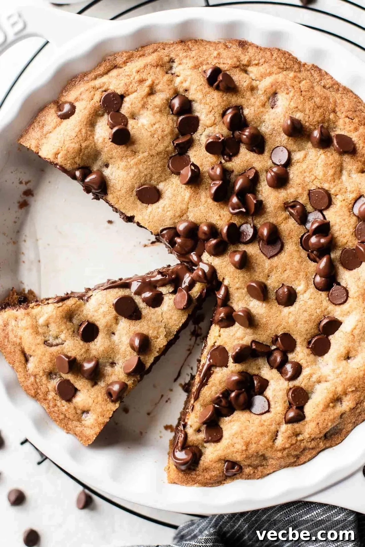 Giant Nutella-Stuffed Chocolate Chip Cookie Recipe 2 sliced GIANT Nutella stuffed chocolate chip cookie in pie dish