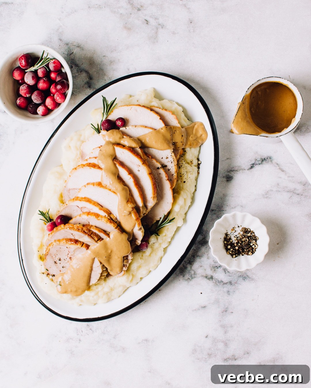 Make-Ahead Brown Gravy with Herbs and Peppercorns 2 plate of turkey with homemade brown gravy drizzled overtop