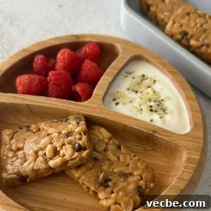 Chewy Chocolate Chip Granola Bars Recipe 12 Chocolate chip chewy granola bars served with berries.