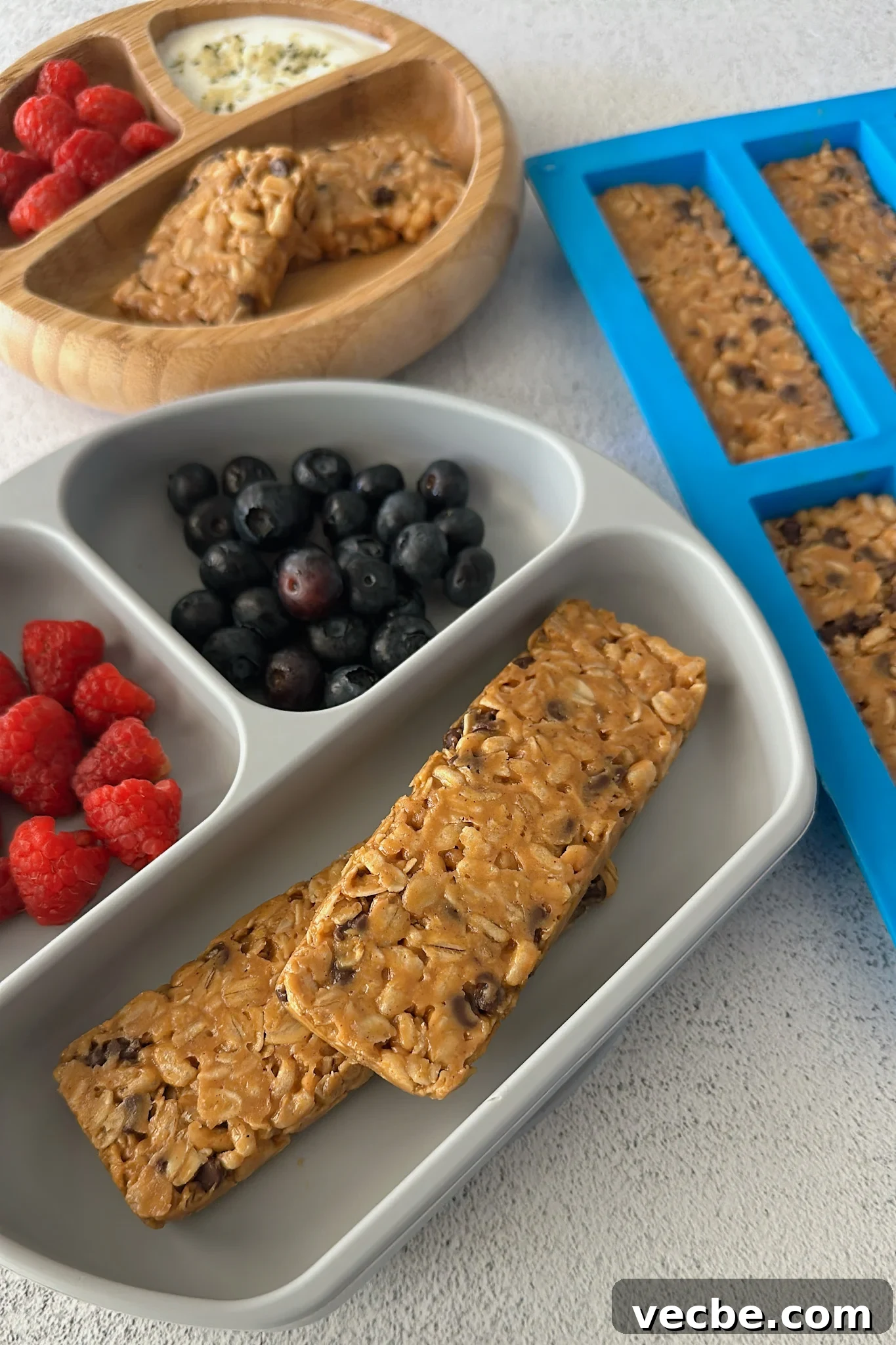 Chewy Chocolate Chip Granola Bars Recipe 6 Chocolate chip chewy granola bars served with berries.