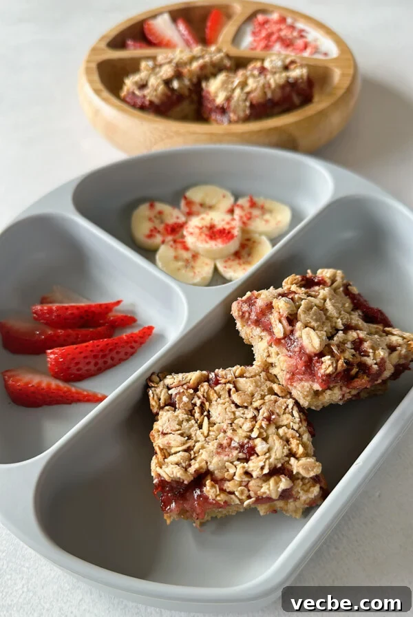 Chewy Chocolate Chip Granola Bars Recipe 9 Strawberry crumble bars served with bananas, strawberries, and yogurt.