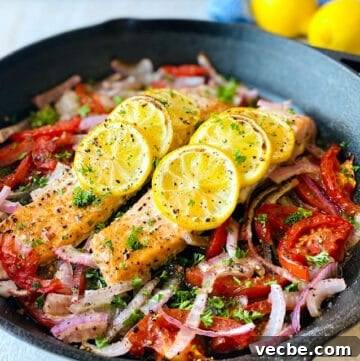 Easy-Baked-Salmon-in-skillet-lemon-in-background