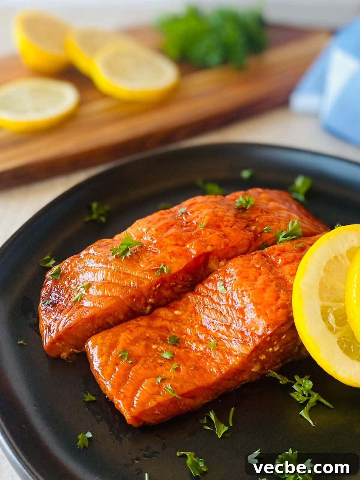 How to Smoke Salmon on a Traeger for Smoky, Flaky Results 4 traeger salmon recipe on a plate with lemon.