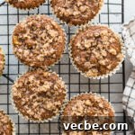 Gluten-Free Apple Recipes: 10+ Desserts, Snacks and More 17 Apple muffins on a black wire rack.