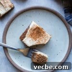 Gluten-Free Apple Recipes: 10+ Desserts, Snacks and More 4 A slice of applesauce cake on a rustic plate.