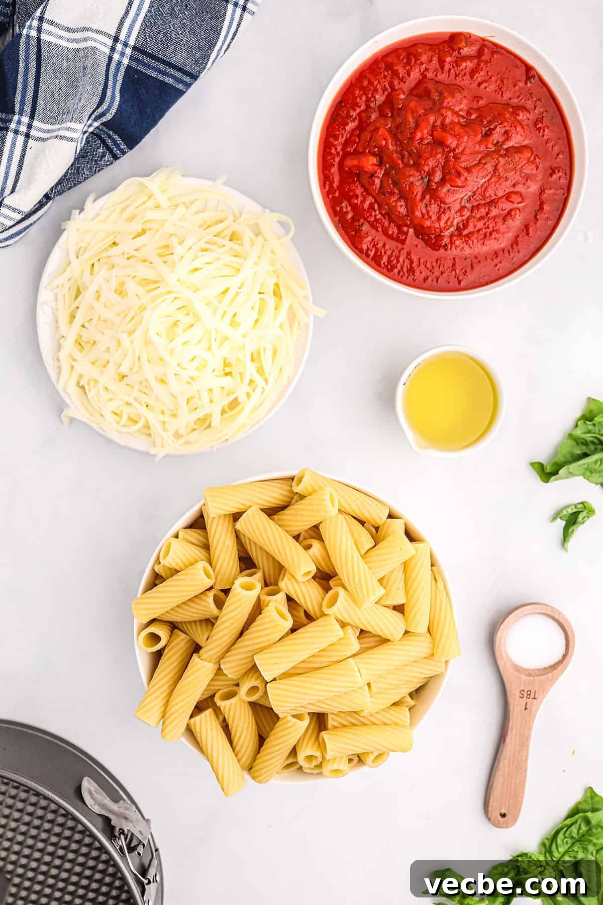 Ingredients for honeycomb pasta ingredients for rigatoni pie including cheese pasta olive oil and sauce