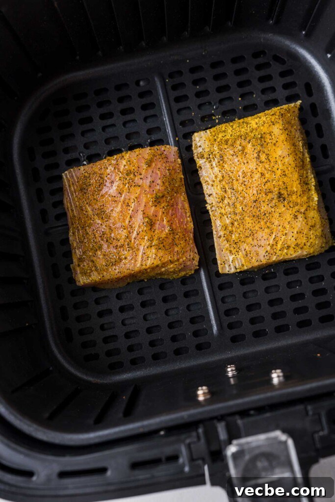 Air Fryer Mahi Mahi with Lemon Garlic 7 mahi mahi fillets in the air fryer basket.