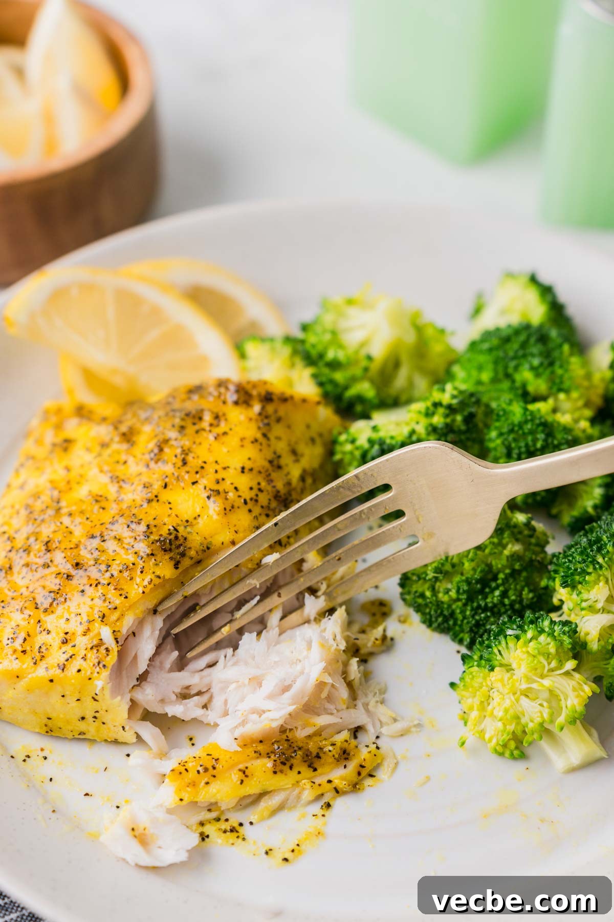 Air Fryer Mahi Mahi with Lemon Garlic 10 mahi mahi on a plate with a fork.