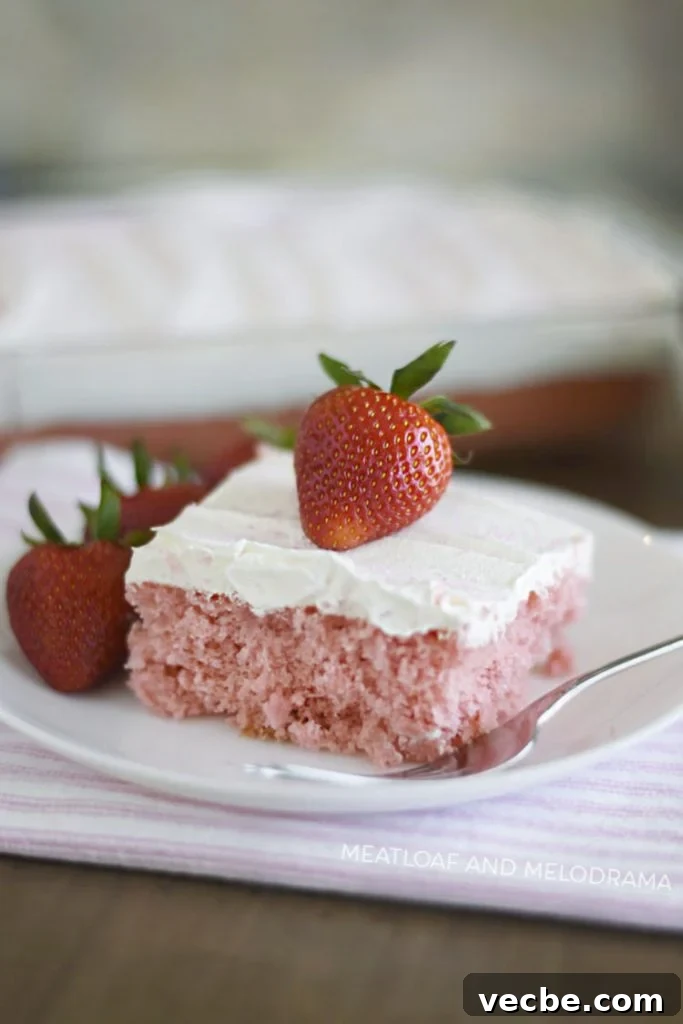 Homemade Strawberry Cream Soda Cake Recipe 6 strawberry cream soda cake with cool whip topping and strawberry on plate