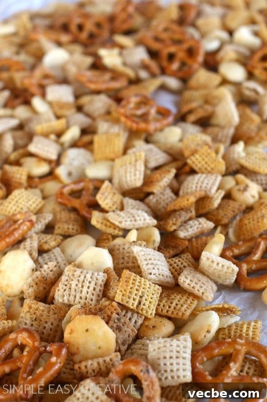 15 No-Bake Snack Recipes You Can Make in Minutes 8 chex mix with pretzels and ranch seasoning on a baking sheet