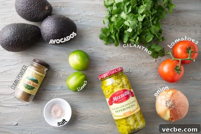 Zesty Tomato and Pepperoncini Guacamole Recipe 3 Ingredients used to make guacamole with tomatoes and pepperoncini.