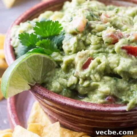 Completed recipe of guacamole with tomatoes and pepperoncini