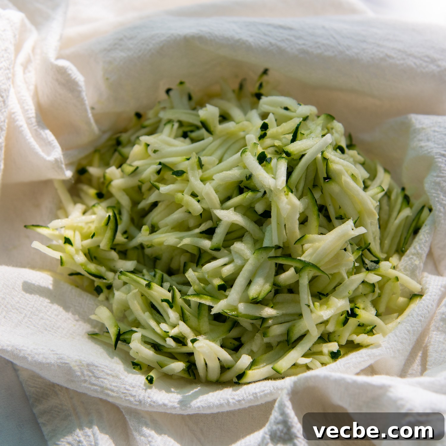 Gluten-Free Almond Flour Zucchini Bread: Secret Moist Recipe 4 zucchini blotted in a white towel.