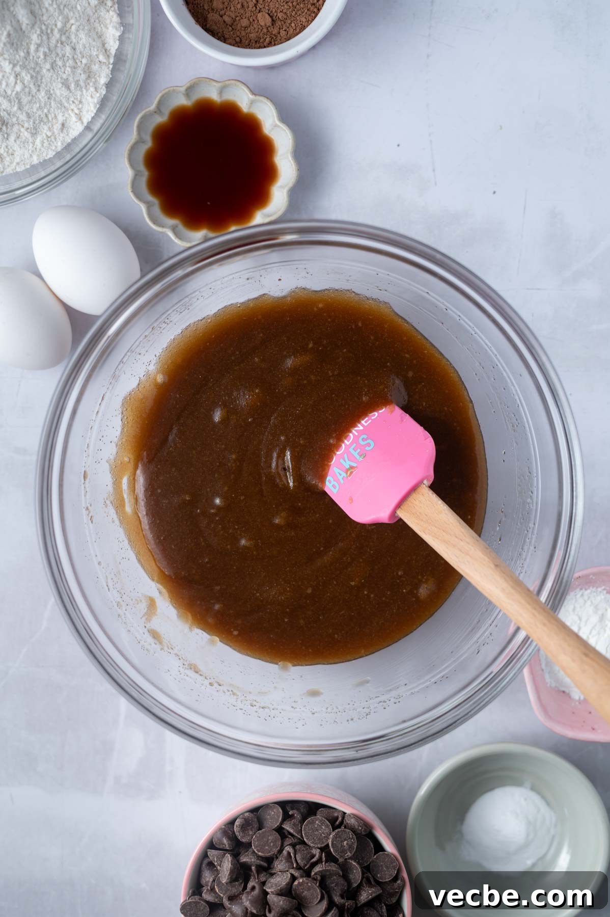 One-Bowl Double Chocolate Chip Bars 5 melted butter and sugars mixed together in a glass bowl