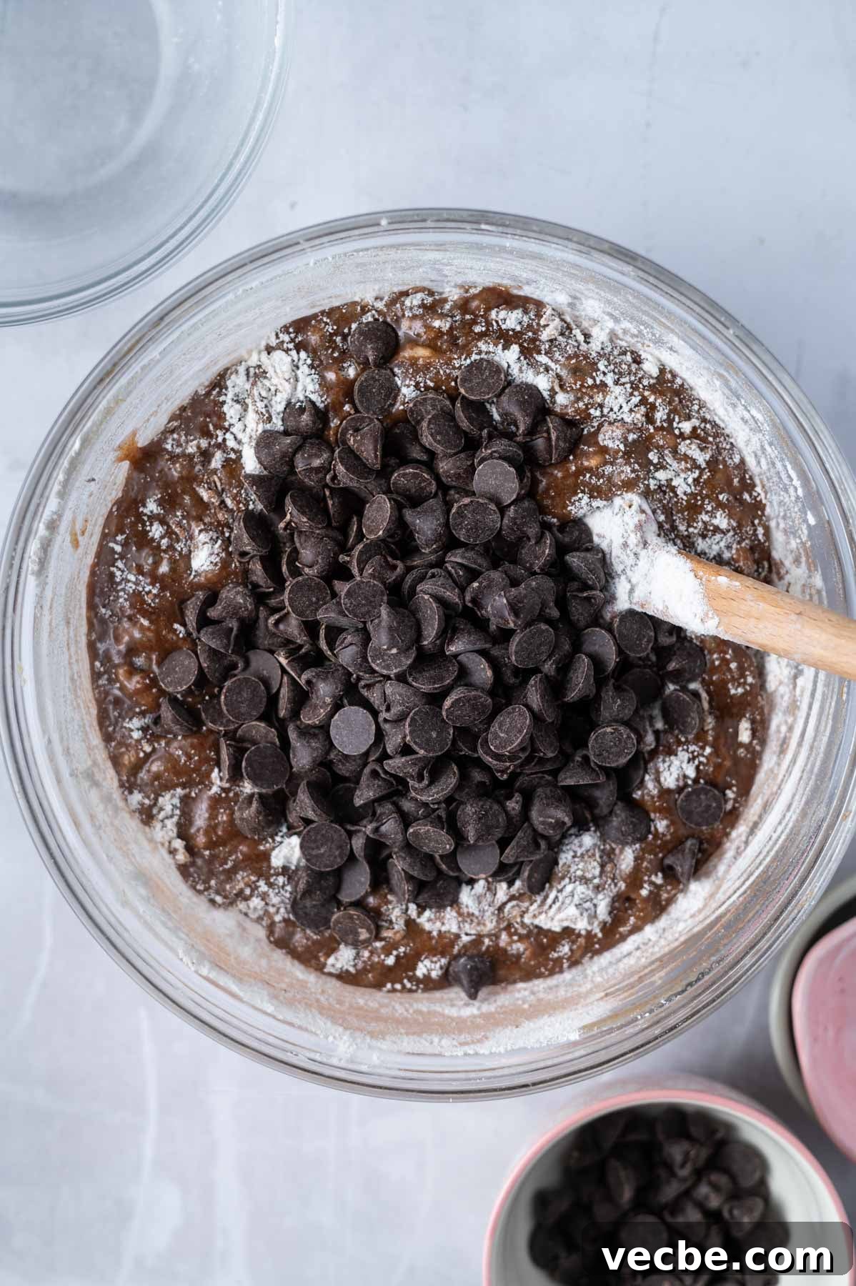 One-Bowl Double Chocolate Chip Bars 8 flour, cocoa powder and chocolate chips added to glass mixing bowl