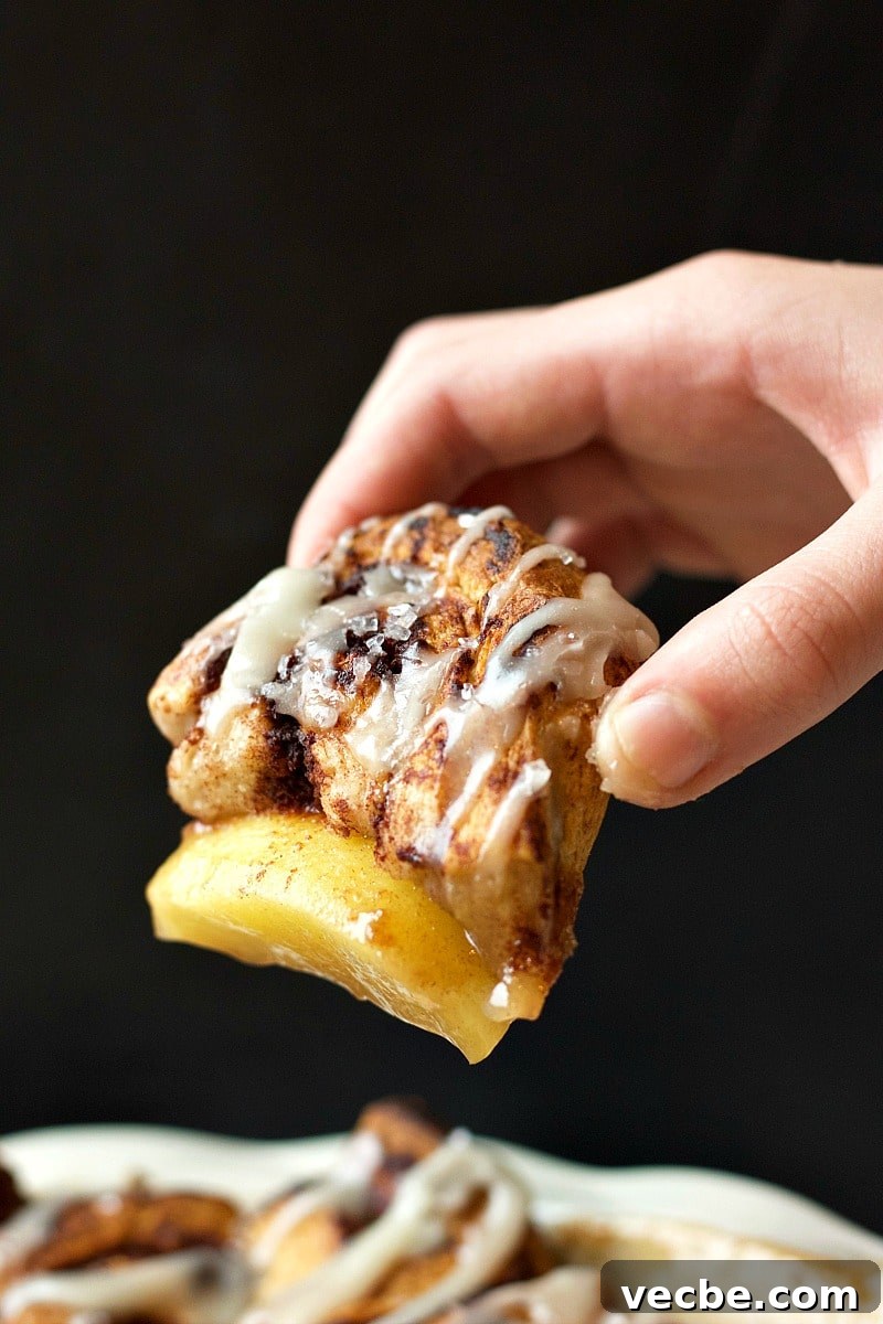 Mini Cinnamon Apple Cobbler Bites 4 Cinnamon Bites Apple Cobbler in hand.