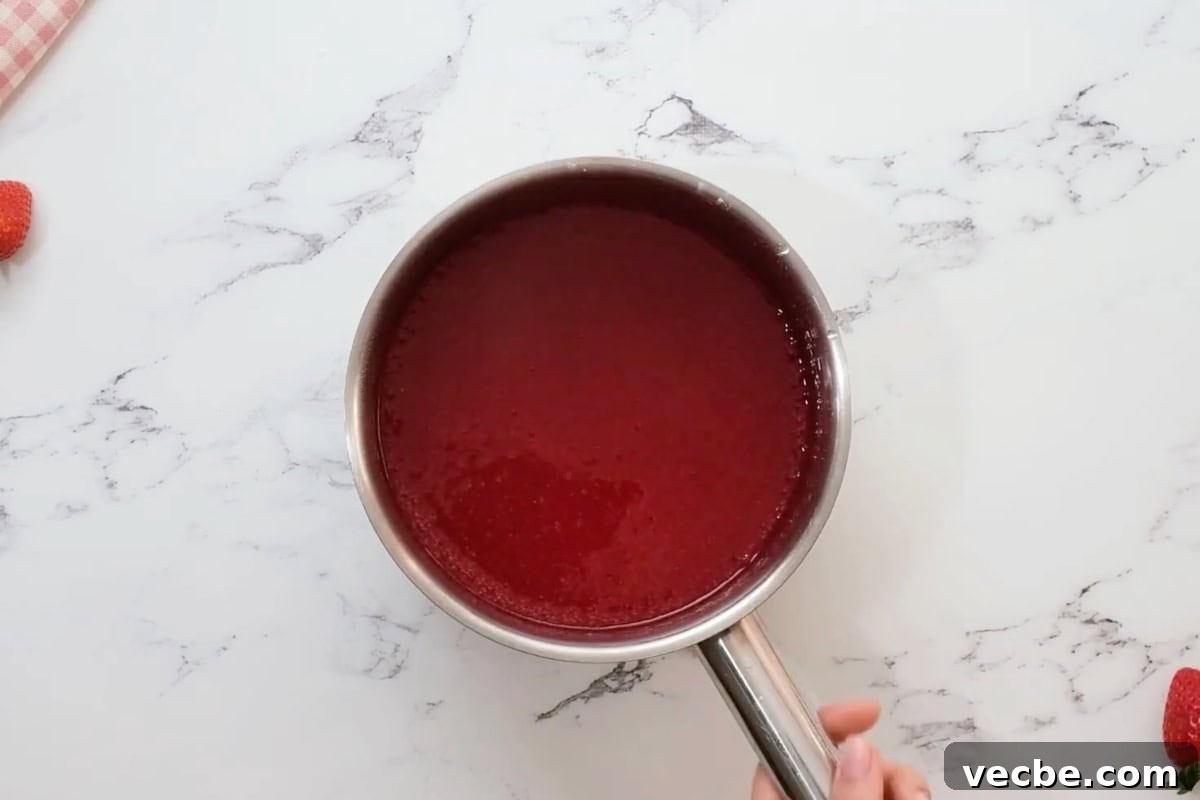 No Bake Strawberry Jello Pie Recipe 16 strawberry jello filling in a saucepan.