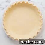 No Bake Strawberry Jello Pie Recipe 5 unbaked pie crust pressed into a pie dish with crimped edges.