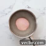No Bake Strawberry Jello Pie Recipe 8 adding strawberry jello powder to cornstarch, sugar, and water in a saucepan.