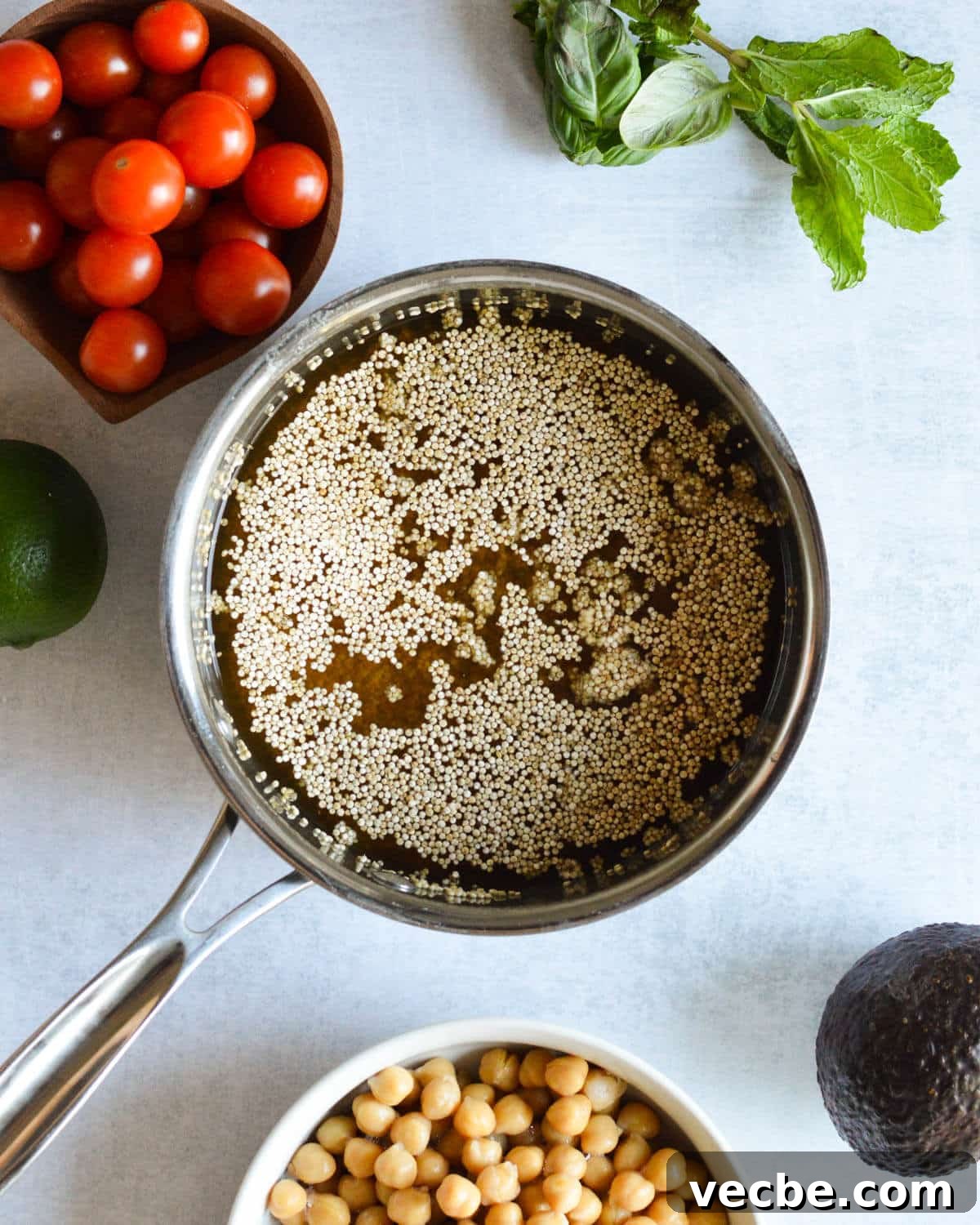 Herbed Quinoa Salad with Avocado and Chickpeas 4 a small saucepan with quinoa and vegetable stock in it.