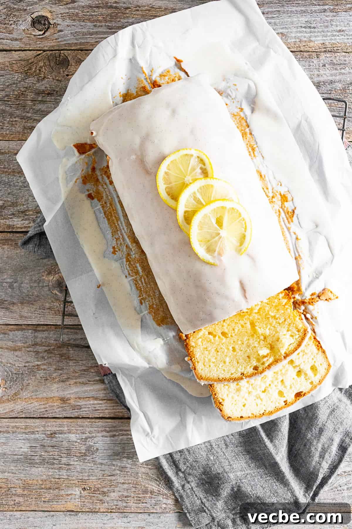 Classic Vanilla Lemon Pound Cake Recipe 5 Vanilla Lemon Pound Cake glazed and topped with sliced lemons.