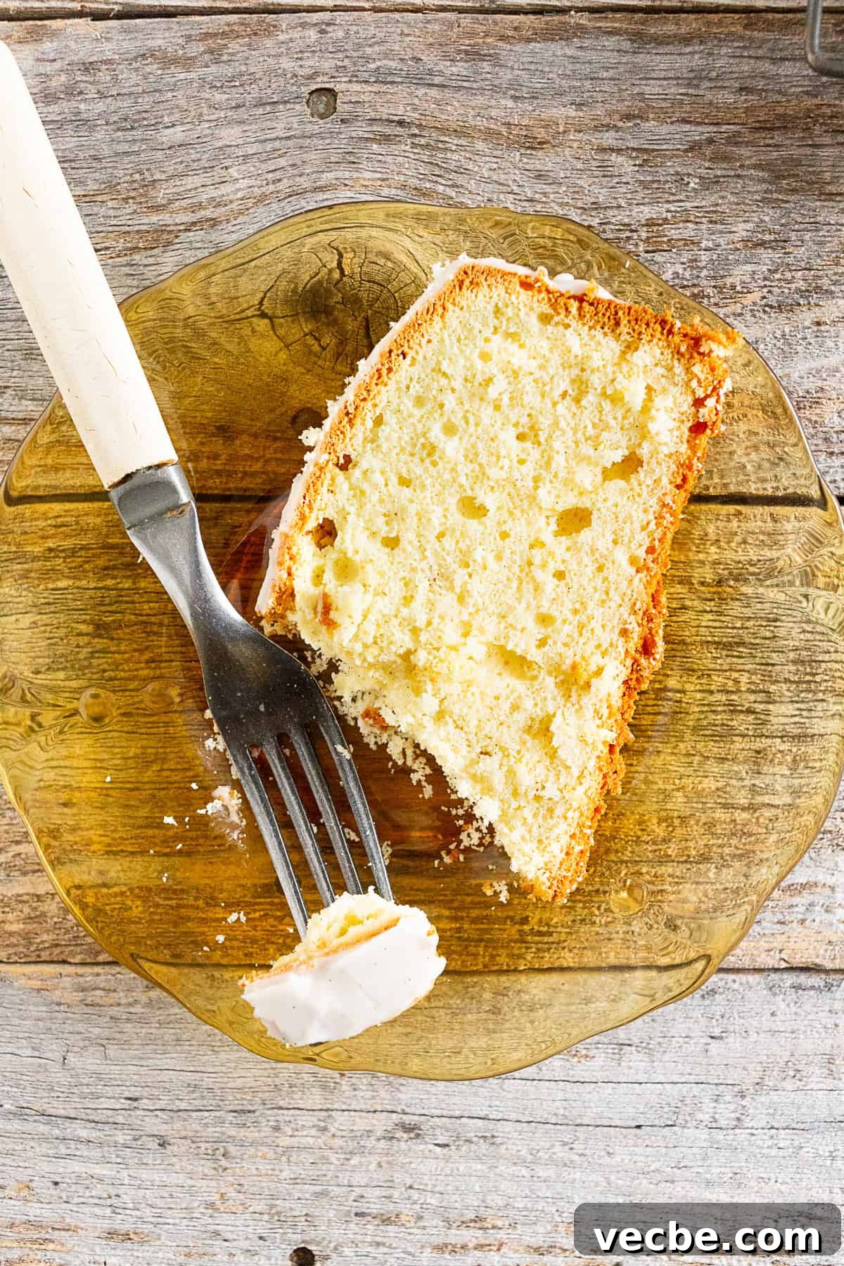 Classic Vanilla Lemon Pound Cake Recipe 6 Vanilla Lemon Pound Cake sliced on a plate.