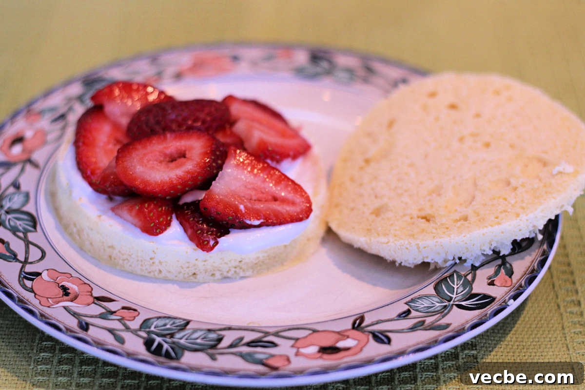 Quick Paleo Strawberry Lemon Shortcake Recipe 5 Layering the cream and berries on the shortcake.