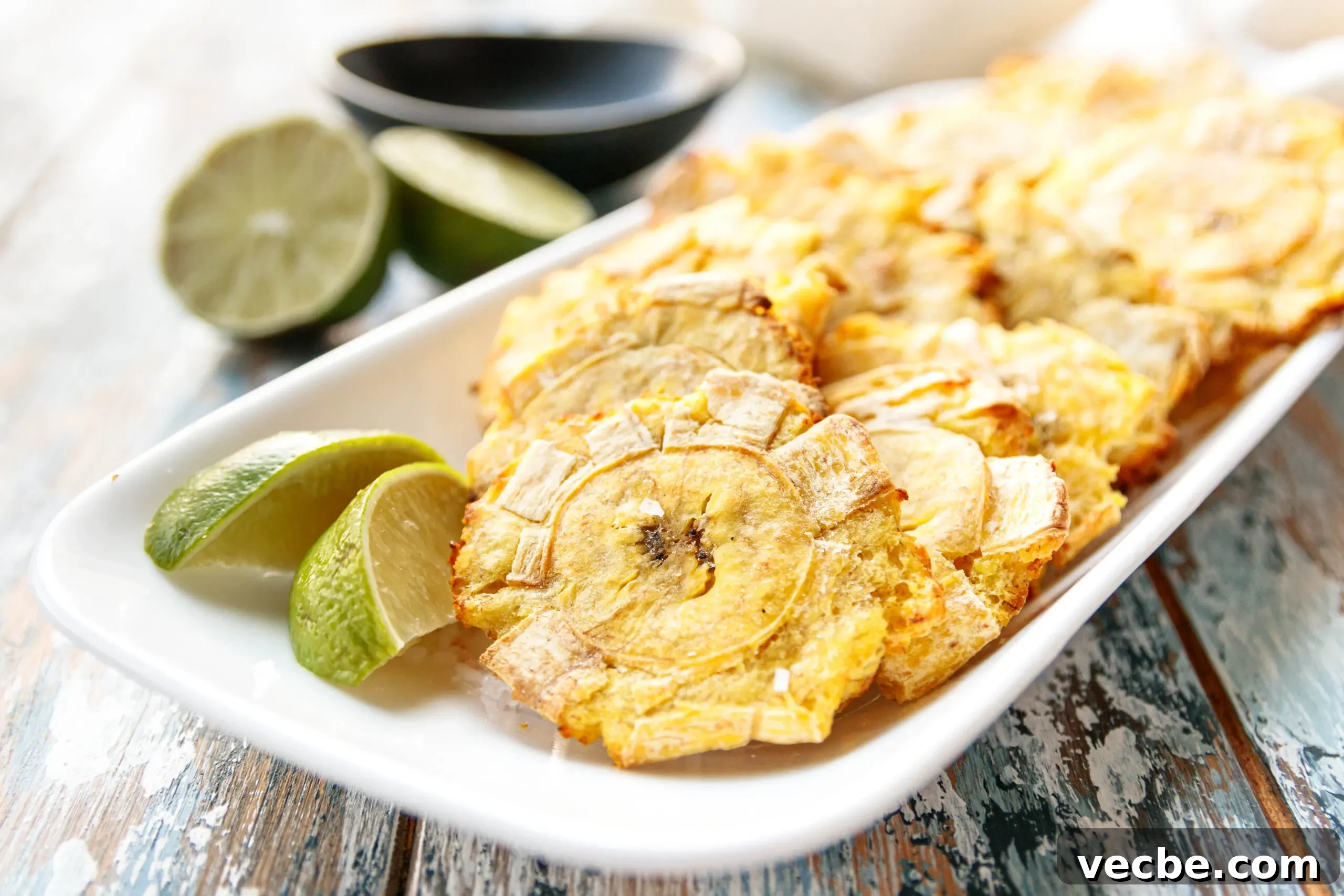 Air Fryer Tostones Cuban Fried Plantains 6 air fryer tostones served on a plate