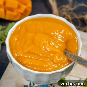Mango coulis served in a bowl.