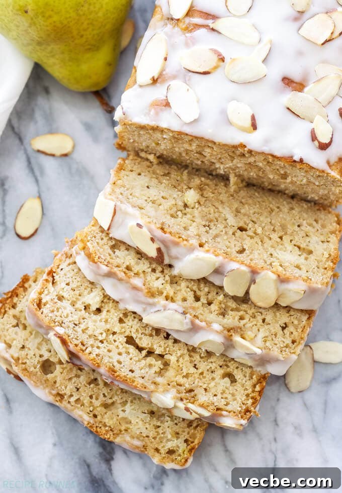 Almond-Glazed Pear Loaf Recipe 4 pear bread slices on a countertop