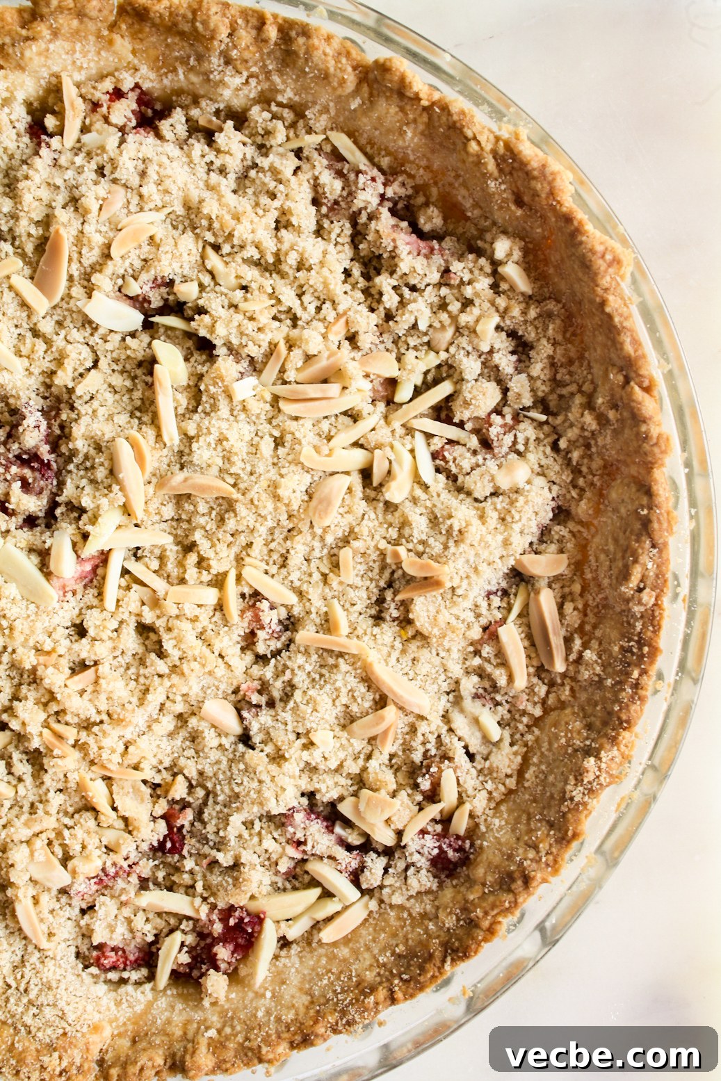 Strawberry Crumble Pie with Buttery Streusel 3 Juicy strawberries on homemade pie crust with a crunchy crumble topping