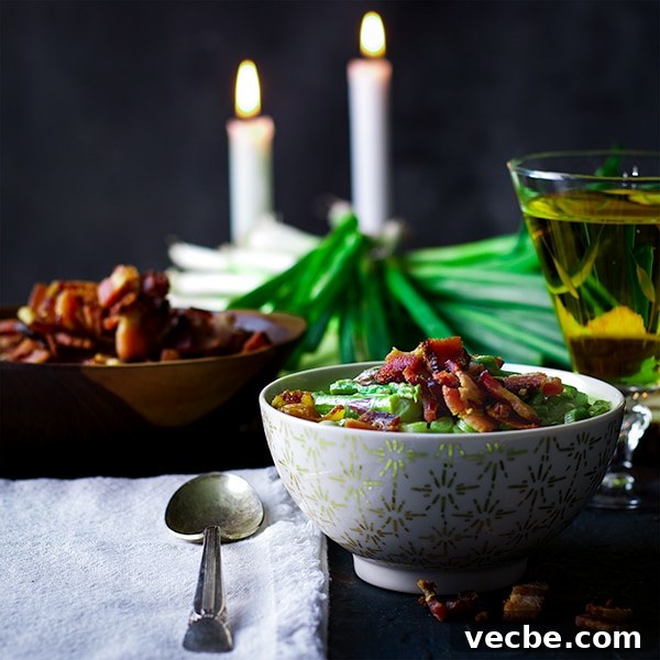 Creamy Asparagus Soup with Crispy Bacon 6 A bowl of Cream of Asparagus Soup topped with bacon.