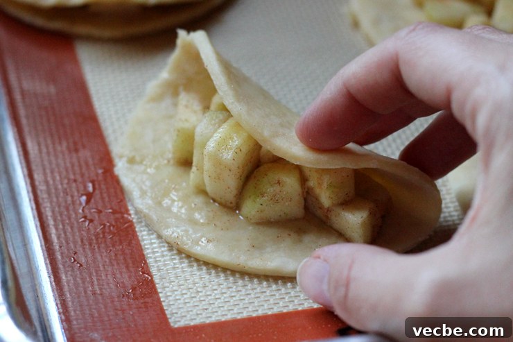 AppleCheddarHandpiesFold Folding apple cheddar hand pies.
