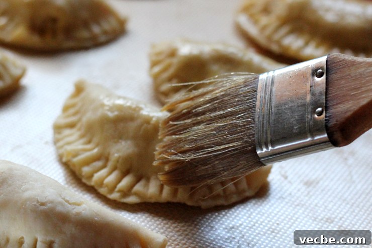 AppleCheddarHandpiesEggWash2 Egg wash brushed on hand pies.