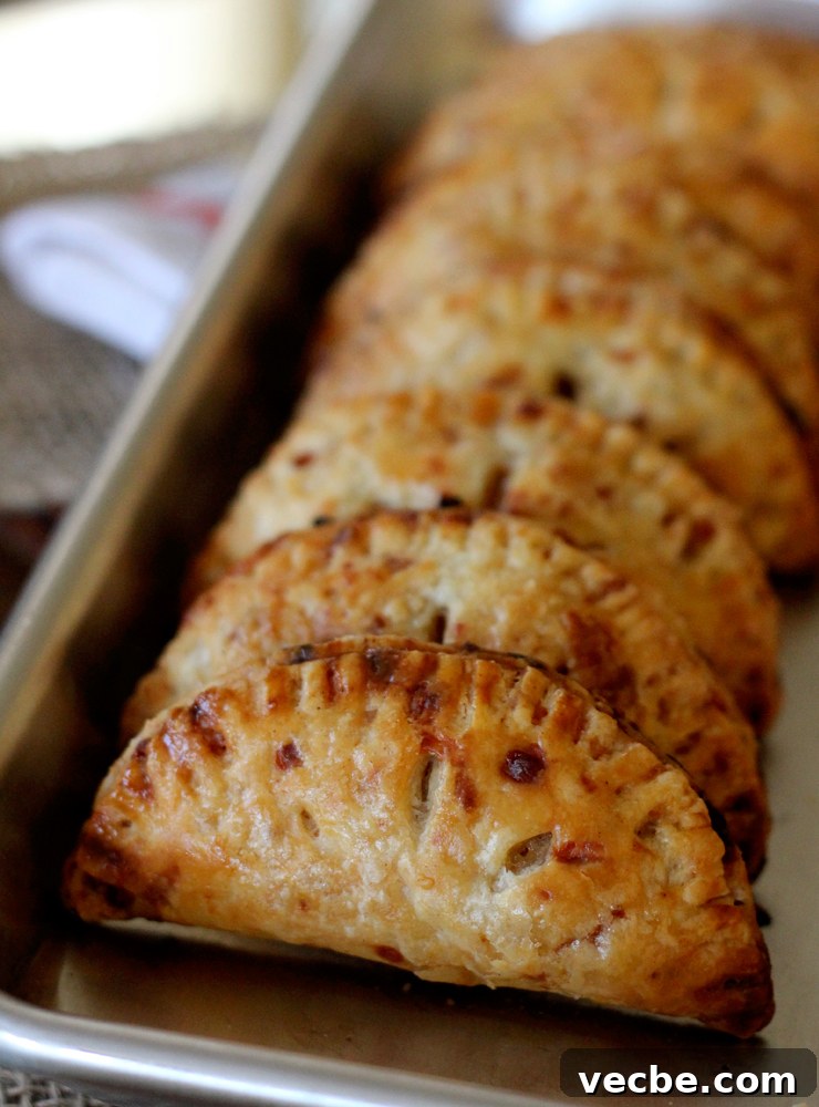 AppleCheddarHandpiesRow Baked apple cheddar hand pies cooling.
