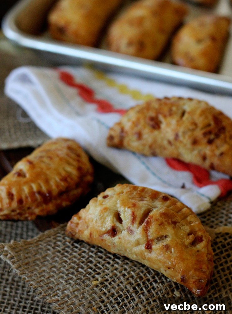 AppleCheddarHandpiesTall Stacked apple cheddar hand pies.