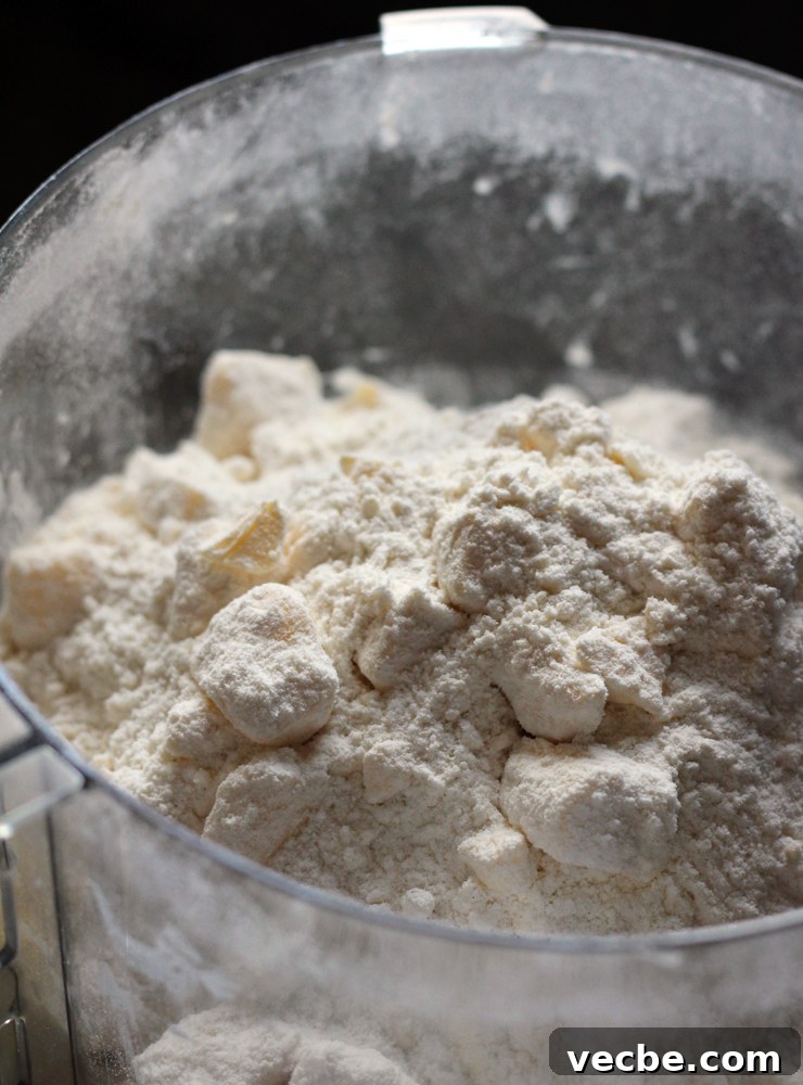 AppleCheddarHandpiesButterCut Butter cut into flour for apple cheddar hand pies.