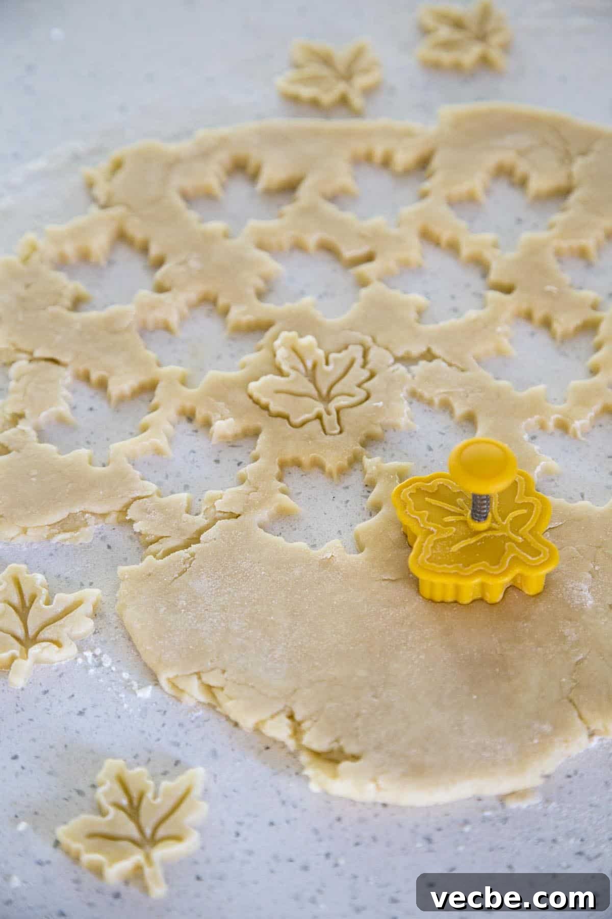 Apple Pie with a Maple Leaf Crust 6 Pie crust being cut into maple leaf shape.