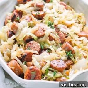 Low-Carb Keto Cabbage Noodles Recipe 5 Cooked sliced sausage and cabbage in serving bowl.
