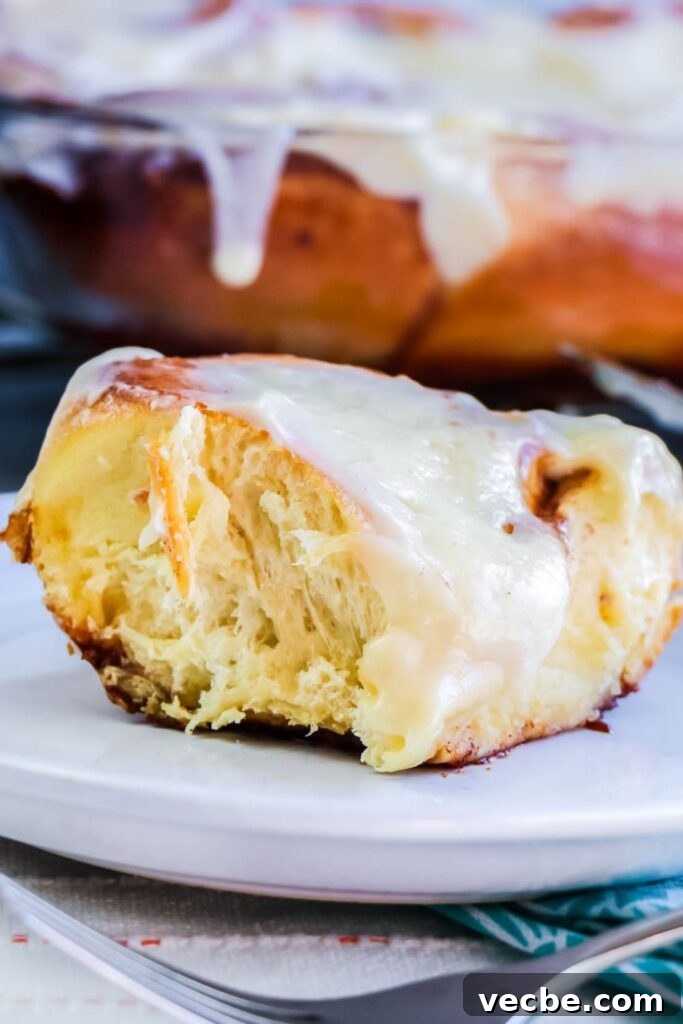 Bread Machine Cinnamon Rolls with Cream Cheese Icing 9 cinnamon roll on plate