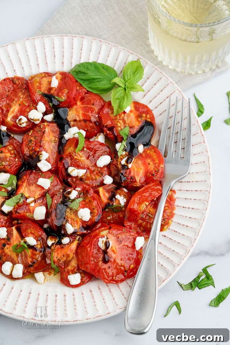 Air Fryer Roasted Tomatoes Recipe 7 the tomatoes on a plate with a glass of wine