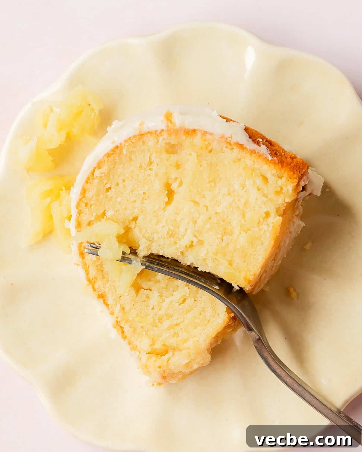 Moist Pineapple Pound Cake with Sweet Tropical Flavor 9 Pineapple pound cake topped with pineapple glaze.