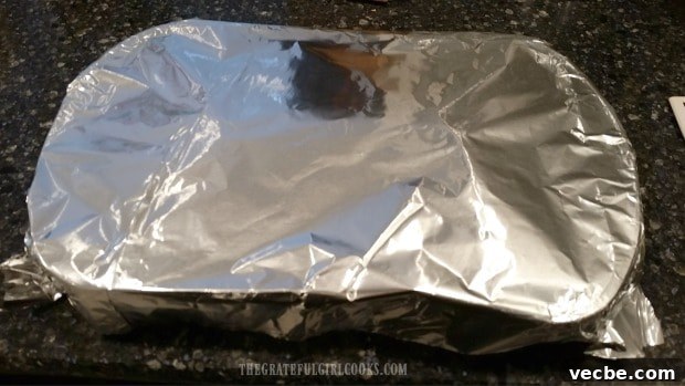 How To Cook Spaghetti Squash Baking dish covered with foil before roasting spaghetti squash